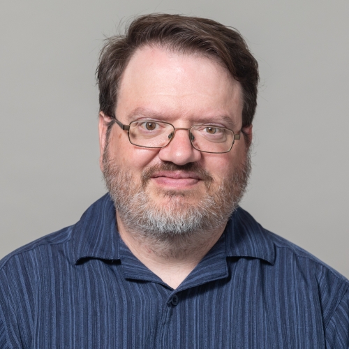 A headshot of PhD in Creativity candidate Andy Carlson.